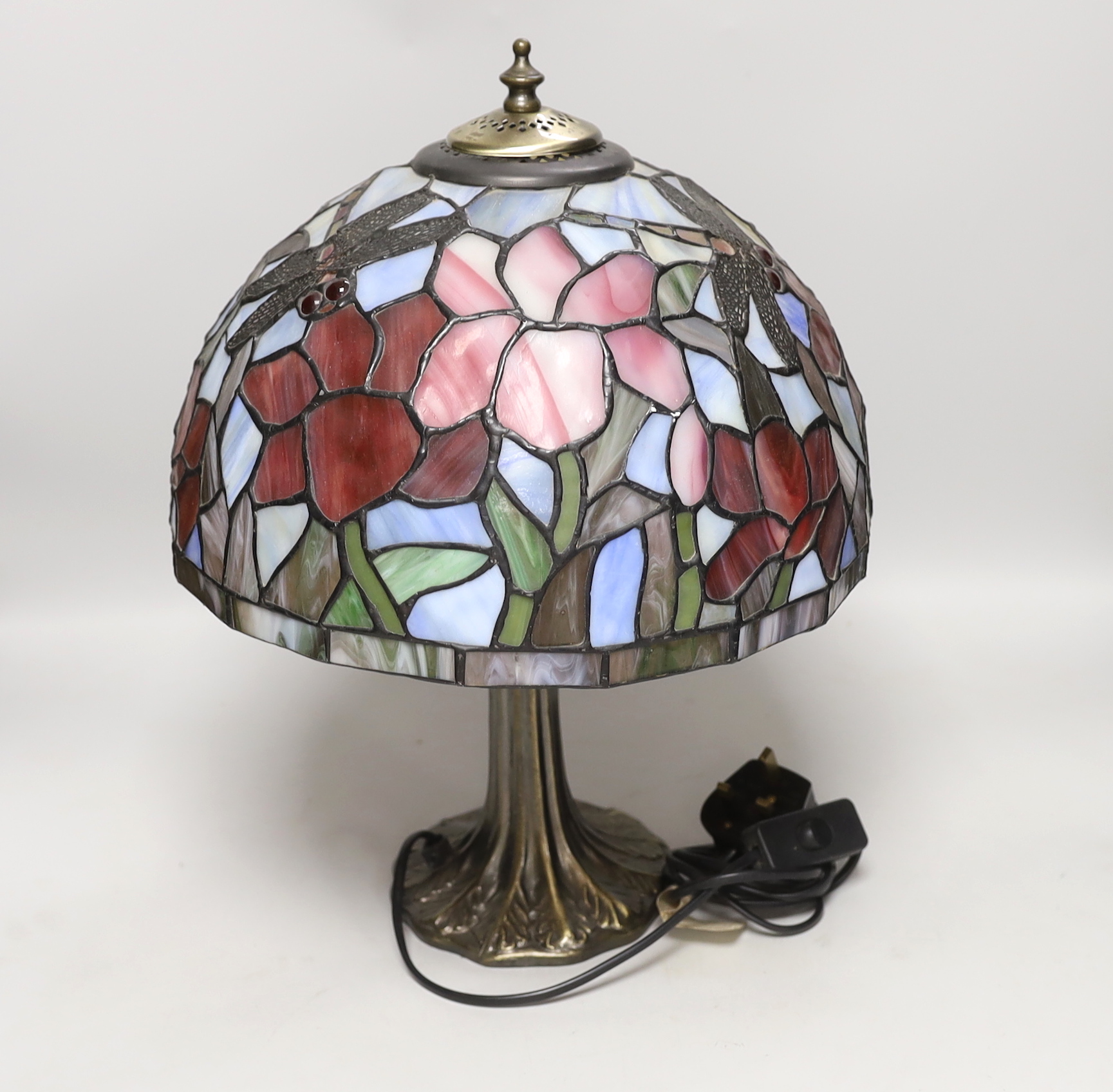 A reproduction Tiffany lamp, leaded glass shade with floral decoration and dragonflies, 40cm